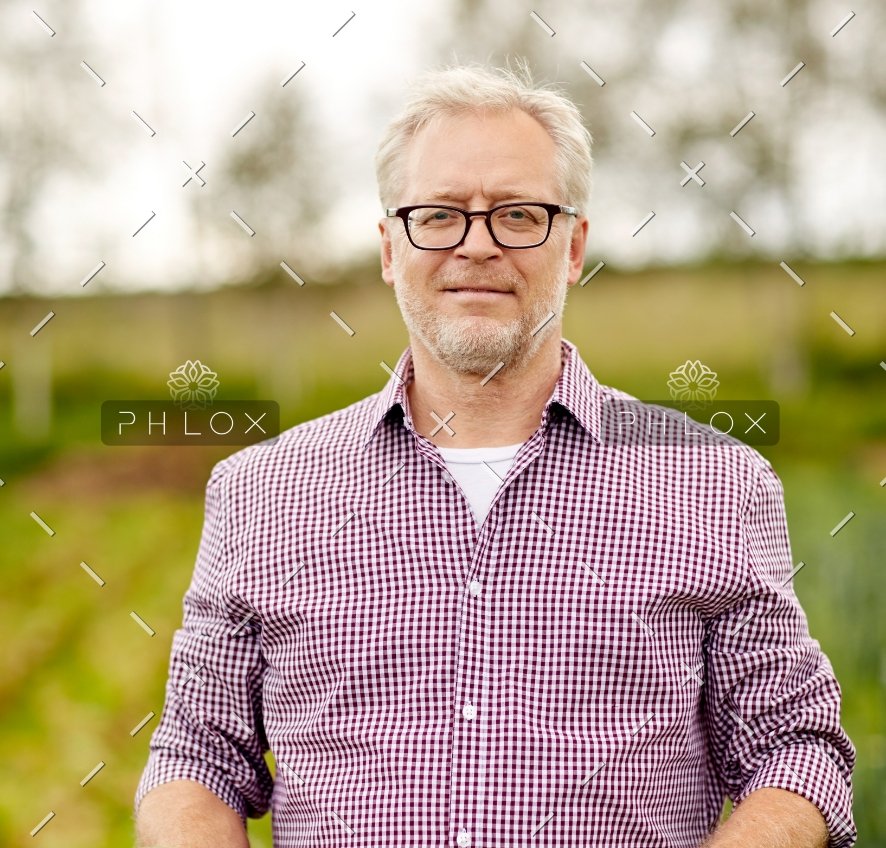 senior-man-with-box-of-vegetables-on-farm-PHMQ8WB@2x-1